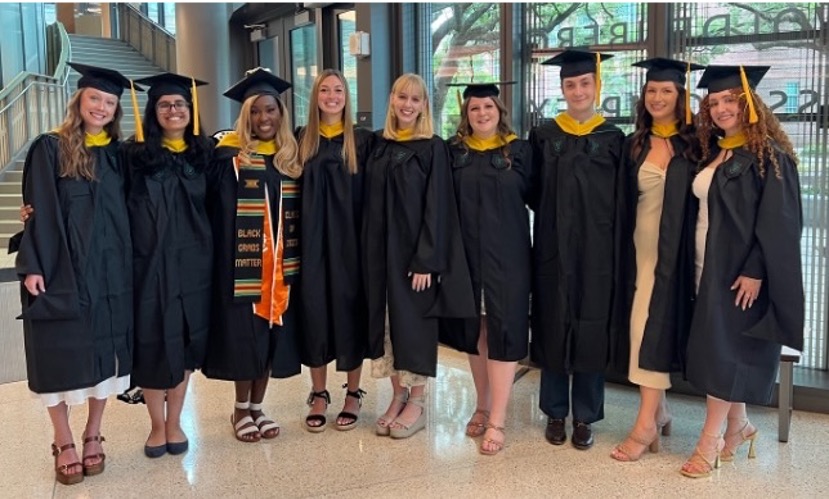 4+1 graduates standing together