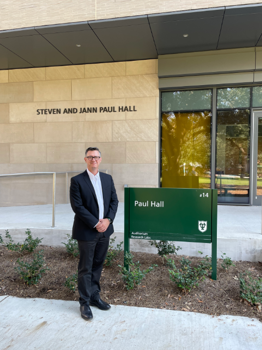 Professor Dan Shantz in front of Paul Hall