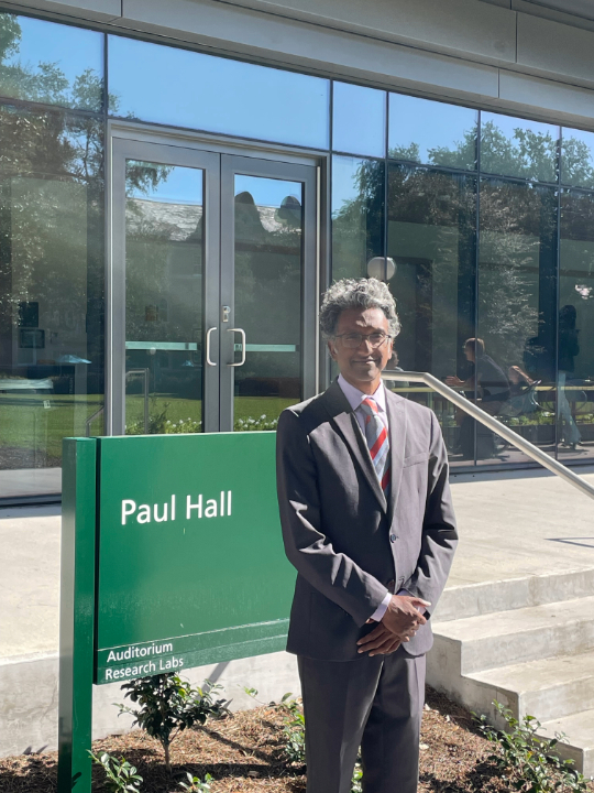 Professor Janarthanan Jayawickramarajah in front of Paul Hall