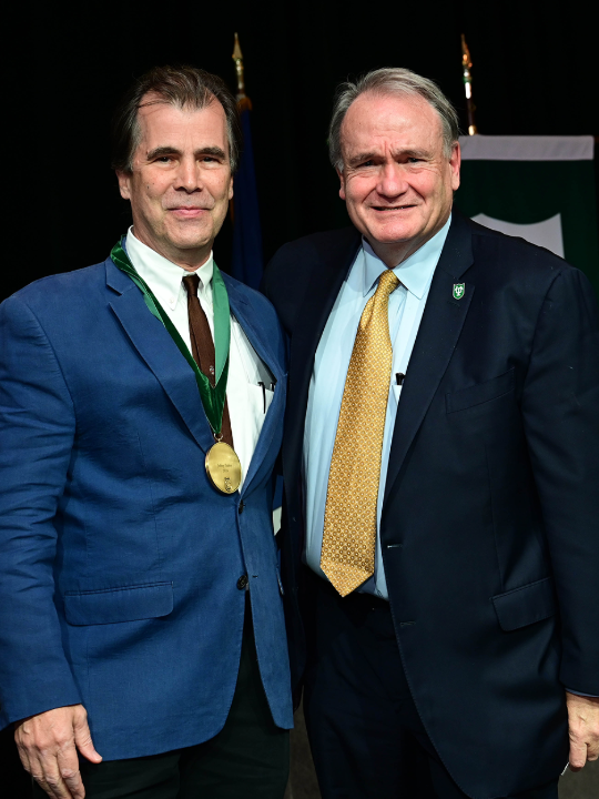 Jeffrey Tasker Receiving Awards from President Michael A. Fitts