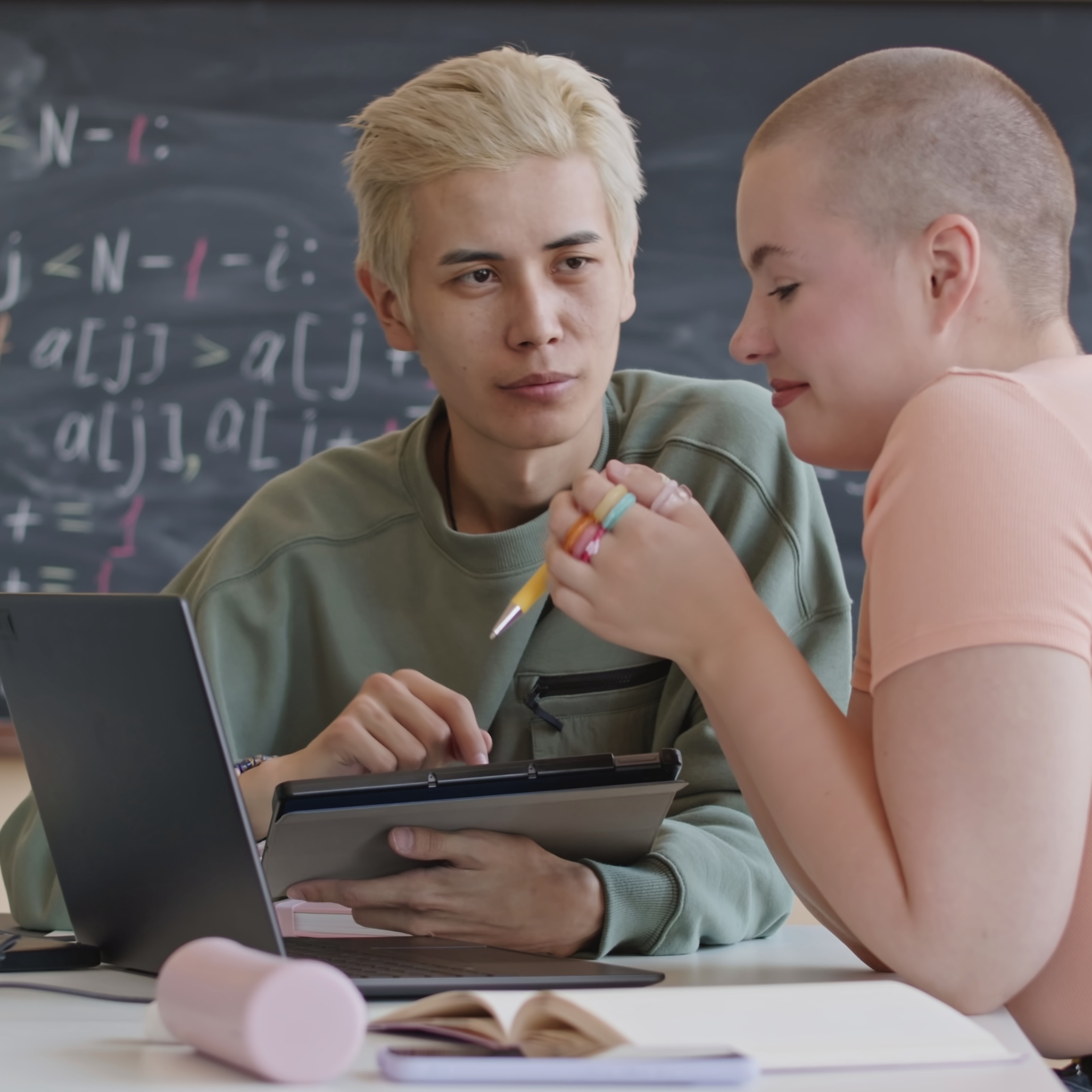 college-students-typing-programming-codes-on-laptops