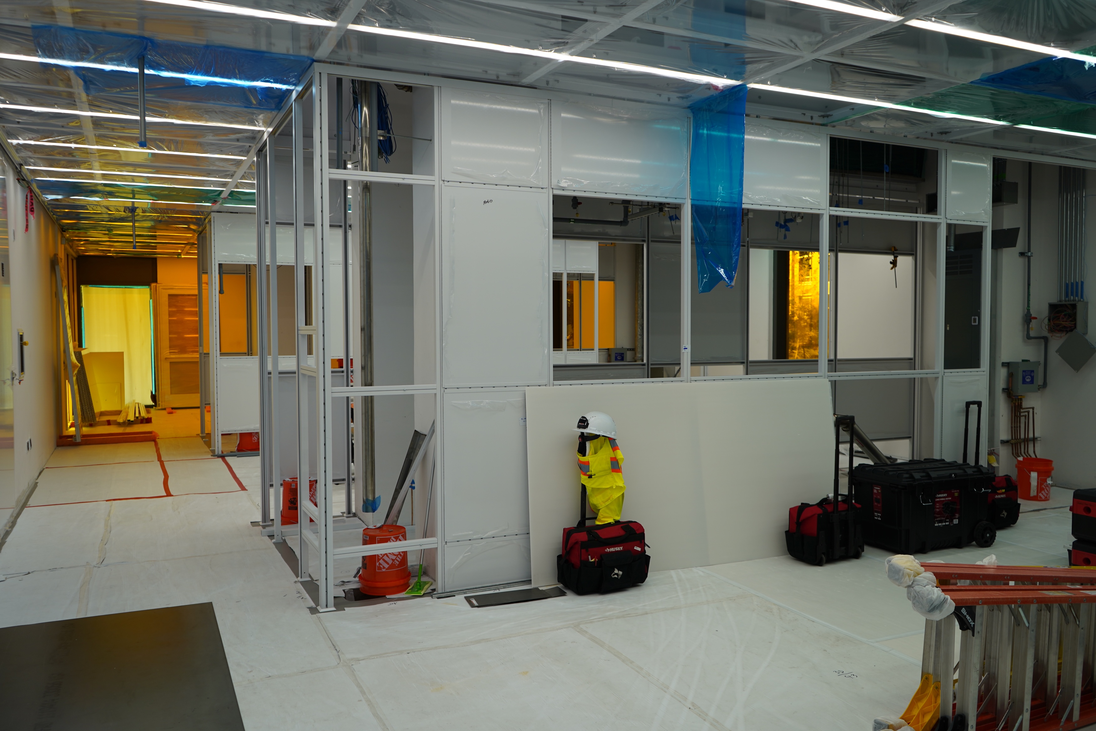 Interior construction of a modern building with metal framing and safety equipment.