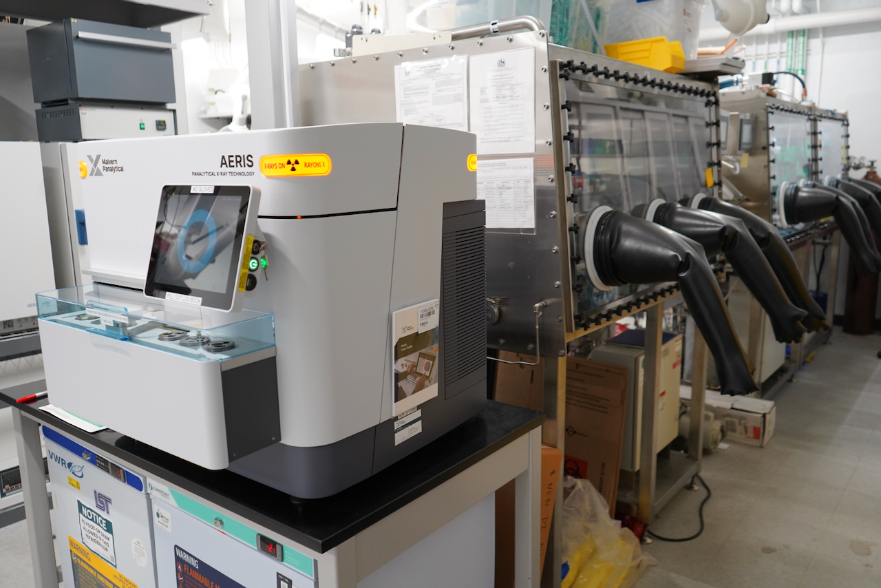 Laboratory equipment including a glovebox system and a scientific instrument.
