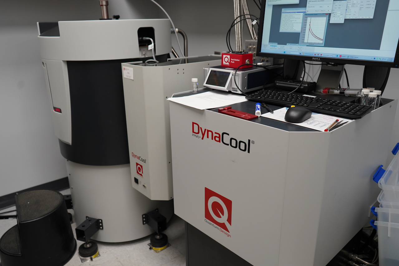 Photograph of a DynaCool laboratory machine with a computer monitor displaying data.
