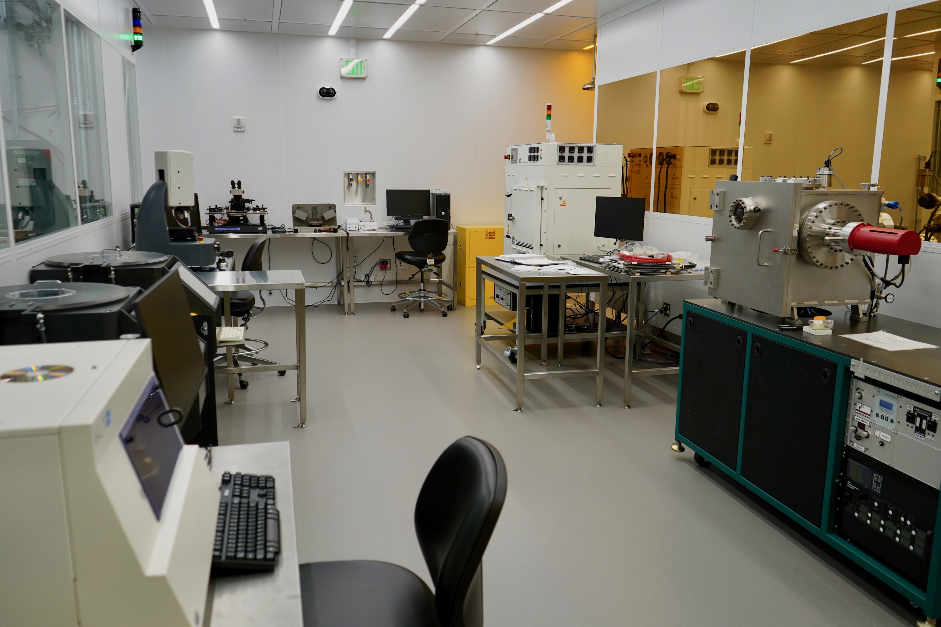 Photograph of a bright, modern laboratory with high-tech equipment and a computer workstation.