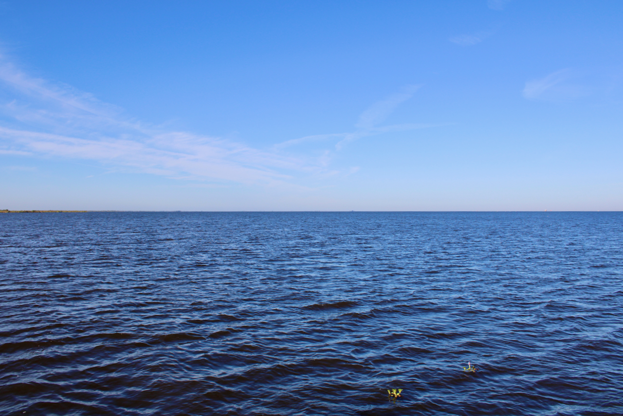 Blue ocean horizon and blue sky