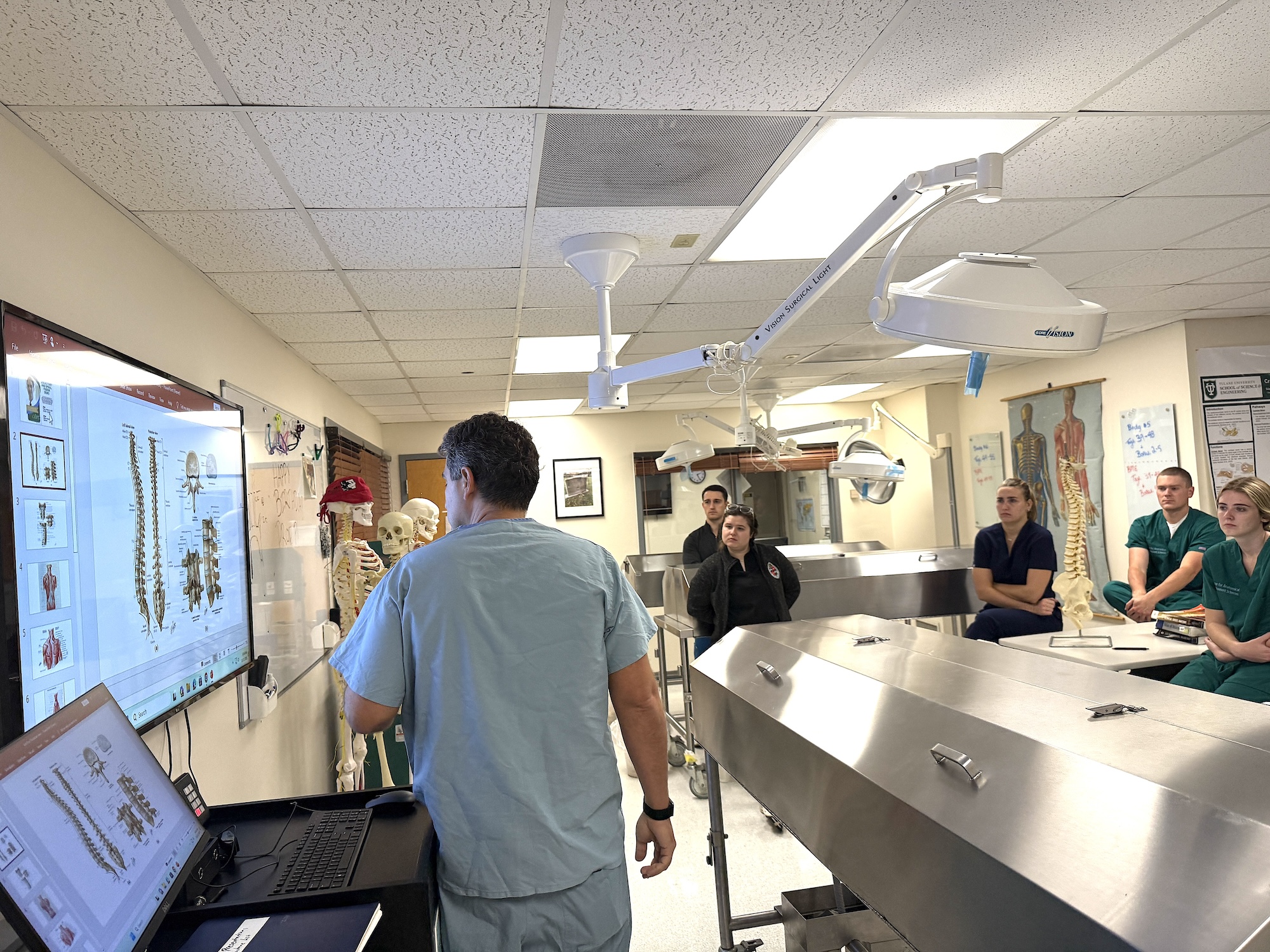 Photograph of a medical lab with an instructor presenting to students.