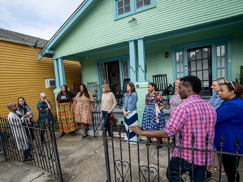 Members of the New Orleans-based Coalition for Compassionate Schools gather outside the Freedom House before a recent retreat. The Freedom House is the one-time home of Oretha Castle Haley. (Photo by Paula Burch-Celentano)