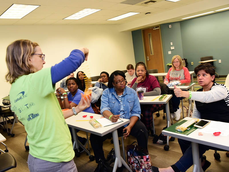 Tulane faculty member displays an activity for teacher professional development workshop