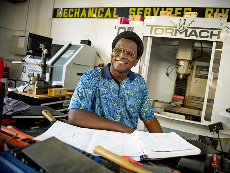 Robert Johnson in the Tulane Makerspace sitting at his project desk