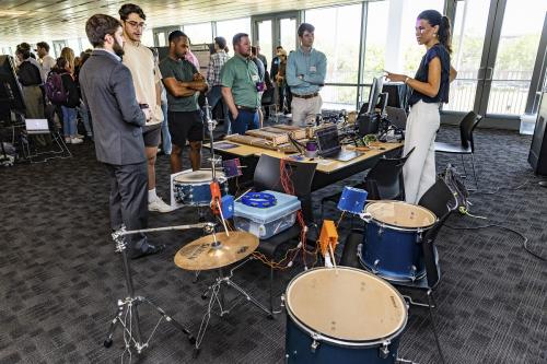 A student demonstrates robots designed to perform musical instruments at the annual Capstone Design Expo. A student demonstrates robots designed to perform musical instruments at the annual Capstone Design Expo.