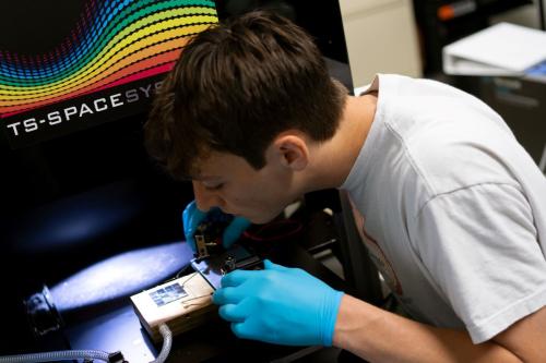 A student working on a solar materials project as part of his undergraduate research experience. A student working on a solar materials project as part of his undergraduate research experience.