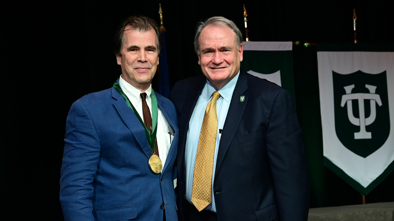 Jeffrey Tasker Receiving an Awards from President Michael A. Fitts